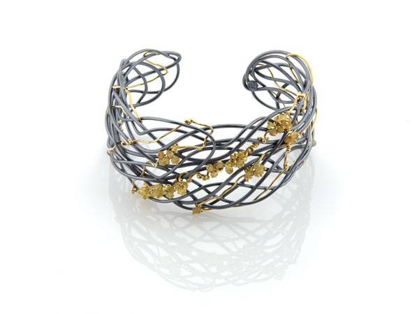 tangle cuff in sterling silver and yellow gold with yellow sapphires