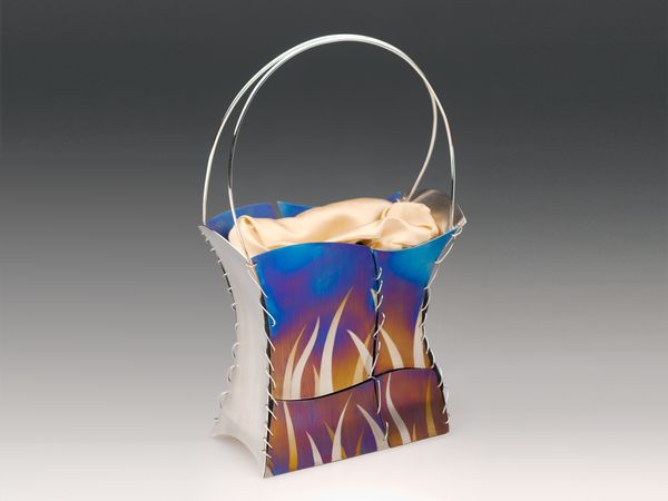 handbag in flame-coloured titanium with silver-plated gilding metal, sterling silver, fine silver, satin